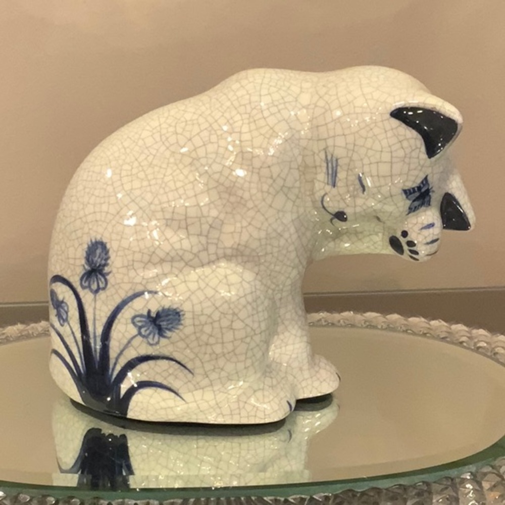 Dedham cat swatting butterfly, blue white